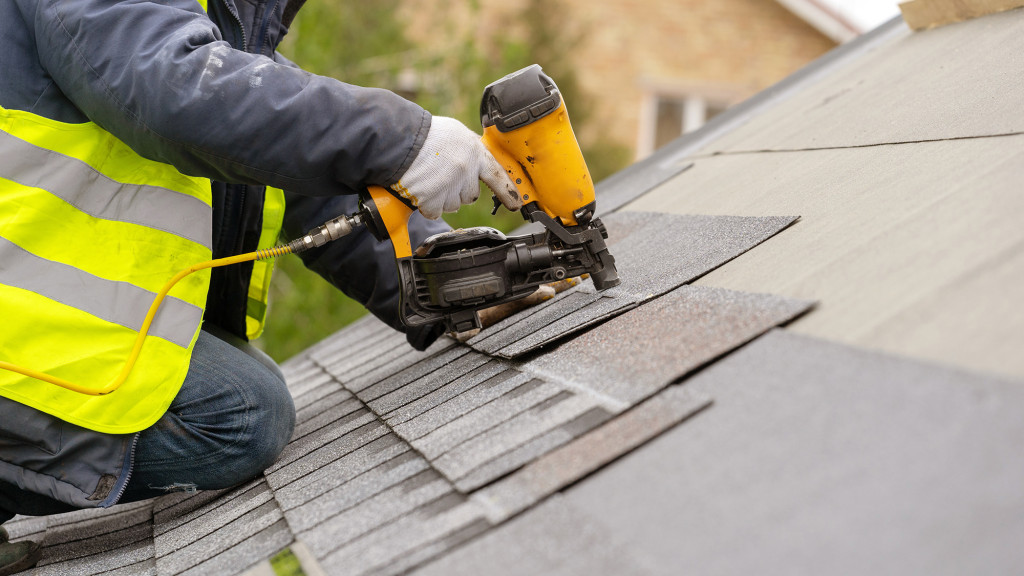 Working installing a roof on a home